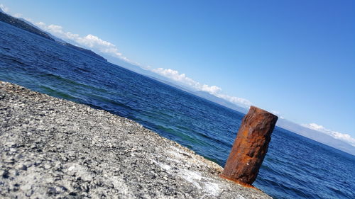 Scenic view of sea against blue sky