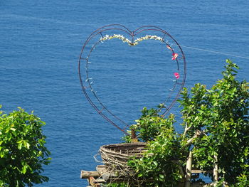 High angle view of heart shape by sea