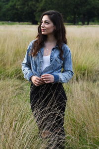 Young woman standing on field