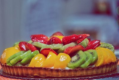 Close-up of fruits on tart at table