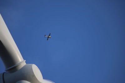 Low angle view of airplane flying in sky