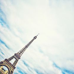 Low angle view of building against cloudy sky