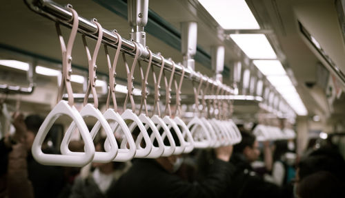 Close-up of handles in train