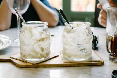 Close-up of leftovers in jars on table