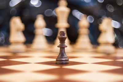 Close-up of chess pieces on board