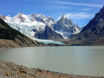 Scenic view of snowcapped mountains and lake against sky