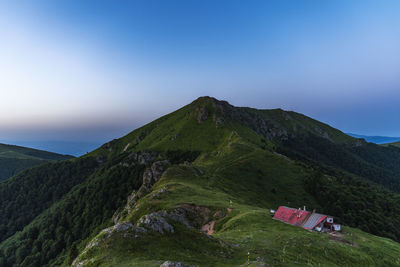 Scenic view of mountains against clear blue sky