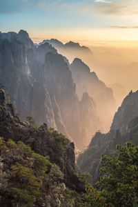 Scenic view of mountains against sky during sunset