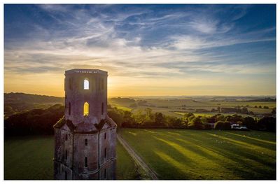 Scenic view of landscape against sky during sunset