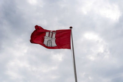 Low angle view of flag against sky