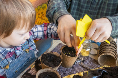 Close-up of boy playing with food