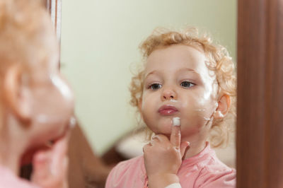 Portrait of cute girl looking at camera