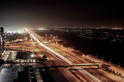 High angle view of light trails on road in city