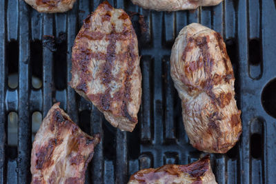 Close-up of meat on barbecue grill