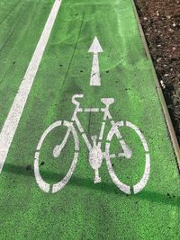 High angle view of bicycle sign on road