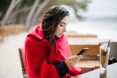 Young woman using mobile phone