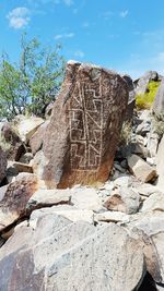 Low angle view of rocks against sky