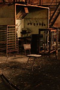 Empty chairs in abandoned building