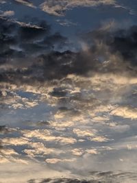 Low angle view of clouds in sky during sunset