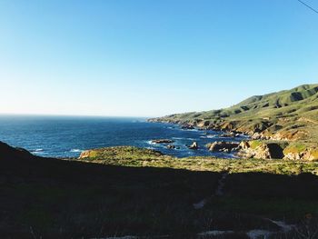 Scenic view of sea against clear blue sky