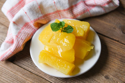 High angle view of chopped fruits in plate on table