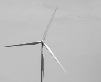 Low angle view of wind turbine against sky