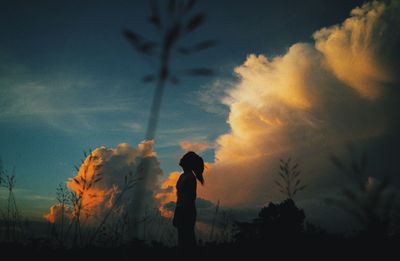 Silhouette of trees against sky at sunset