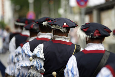 Rear view of men in traditional clothing