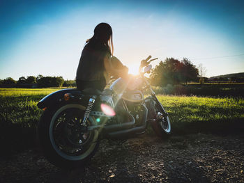 Man riding motorcycle on field