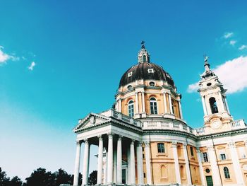 Low angle view of building against blue sky