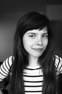 Close-up portrait of smiling young woman