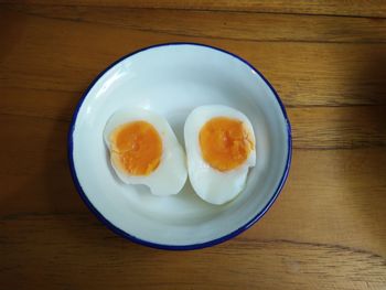 High angle view of boiled egg in bowl on table