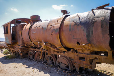 Train on railroad track against sky