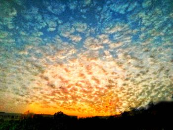Low angle view of dramatic sky during sunset