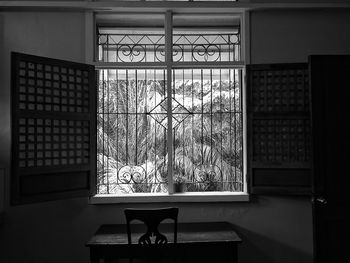 Chairs and table by window in house