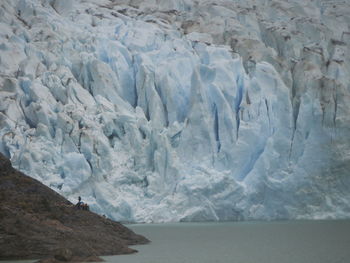 High angle view of glacier on sea shore