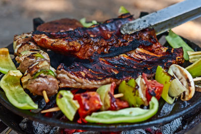 Close-up of meat on barbecue grill