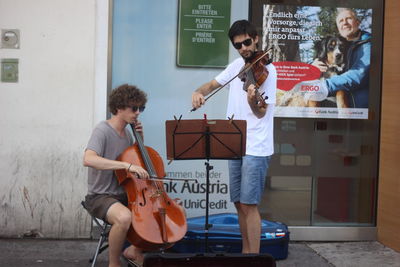 Young woman sitting in front of river