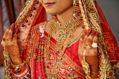 Midsection of smiling young bride at home 