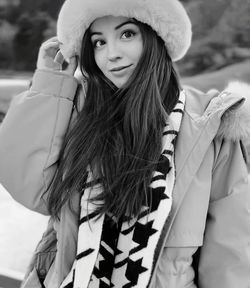 Portrait of young woman outdoors