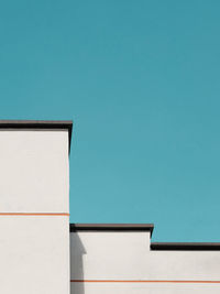 Low angle view of building against clear blue sky