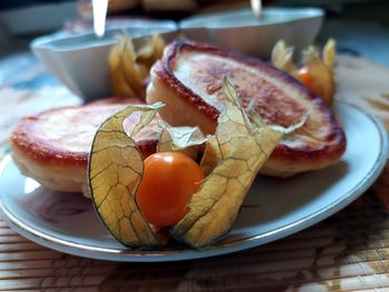 Close-up of fruits in plate on table