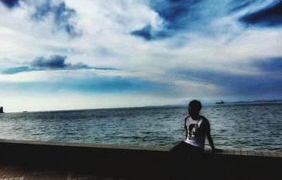 Scenic view of sea against cloudy sky