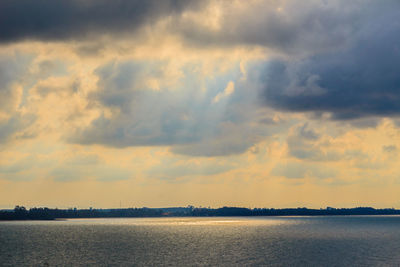 Scenic view of lake against sky during sunset