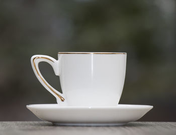 Close-up of coffee cup on table