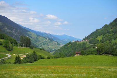 Scenic view of landscape and mountains against sky