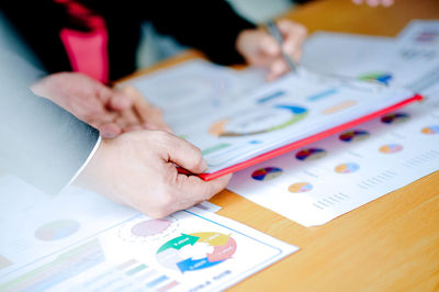 High angle view of business people working on table