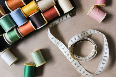 Directly above shot of sewing items on table