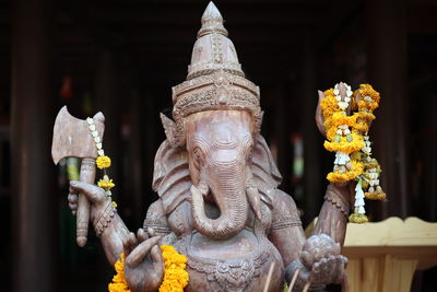 Sculpture of buddha statue outside temple