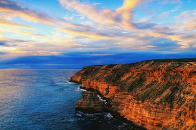 Scenic view of sea against sky at sunset